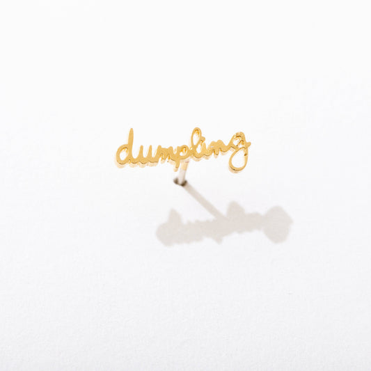 Single 14k gold plated stud earring -- reads "dumpling" in handwritten script