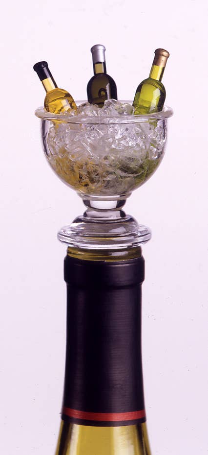 Bottle stopper designed with an acrylic wine bowl filled with ice and 3 wine bottles in it. 