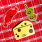 Stickers: Sausage, cheese and olives on a stick. Laying on top of a red and white table cloth.