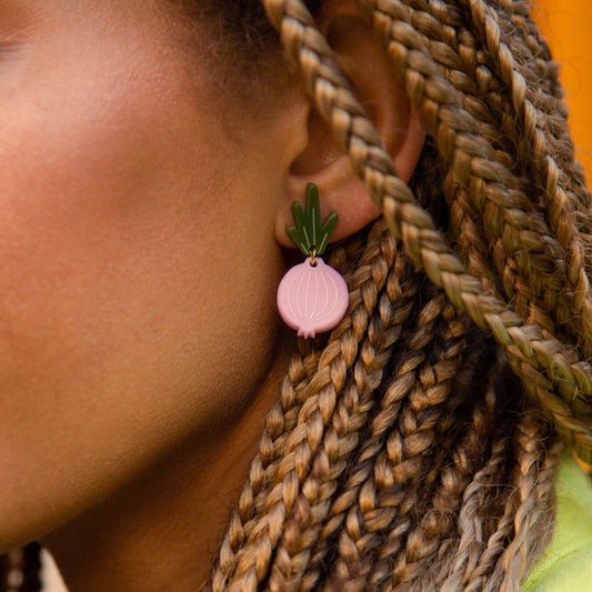 Pink onion earrings worn on model for size 