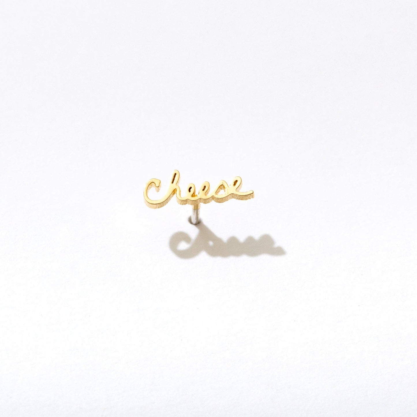 Single 14k gold plated stud earring -- reads "cheese" in handwritten script
