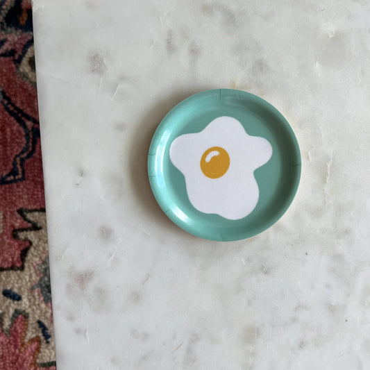 Egg trinket dish. Sunny side up egg on a aqua background.