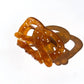 Pretzel hair clip -- brown with white specks to mimic salt, made out of cellulose acetate