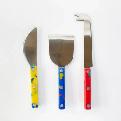 Set of 3 cheese knives, each with a different colored handle -- yellow (soft cheese), blue (semi-soft cheese) and red (hard cheese) 