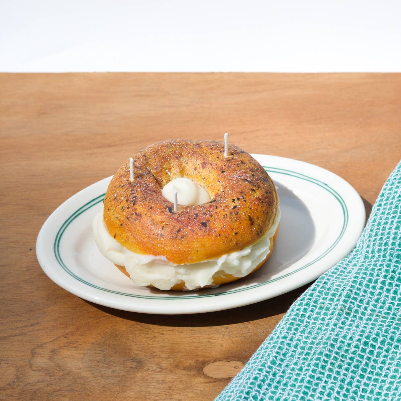 Everything Bagel Candle on a diner plate.