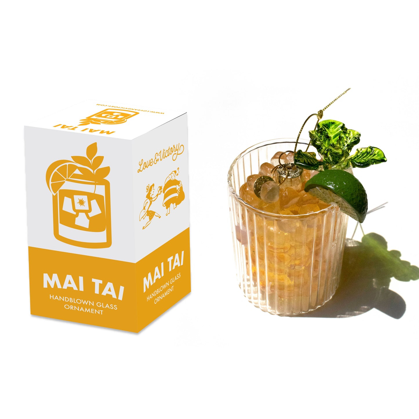 Hand blown glass ornament in the shape of Mai Tai with display box.