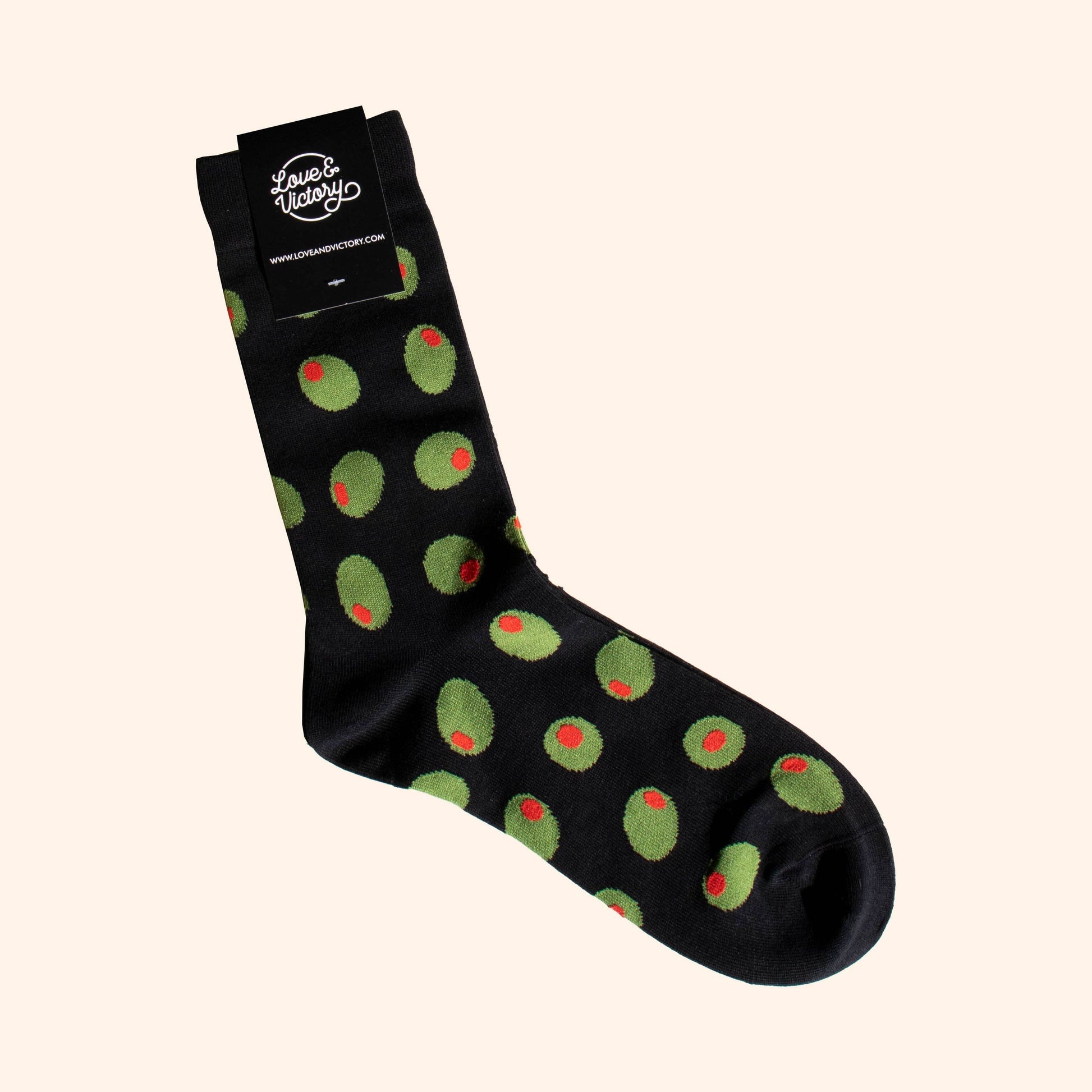 Black socks with stuffed green olives on it 