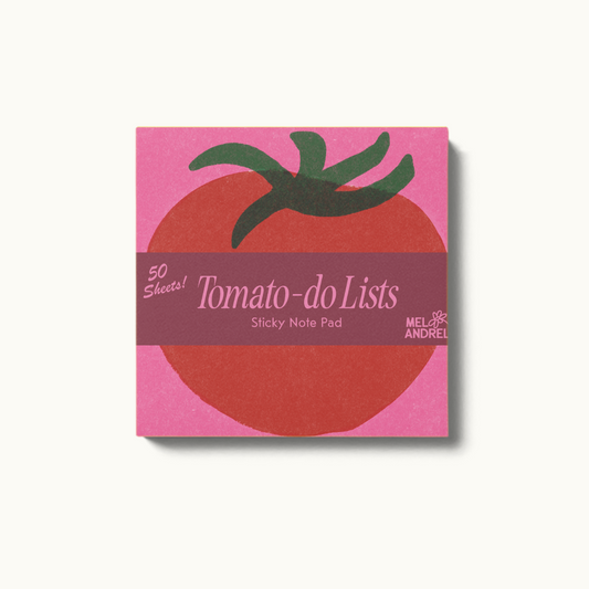 Pink post-it note pad with a red tomato illustration on it 
