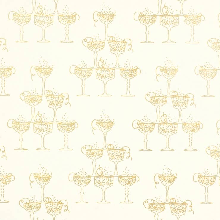 Gold foil gift wrap with champagne couples bubbling over with liquid. Cream and gold paper.