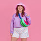 Neon watermelon fanny pack worn as a cross body on model 