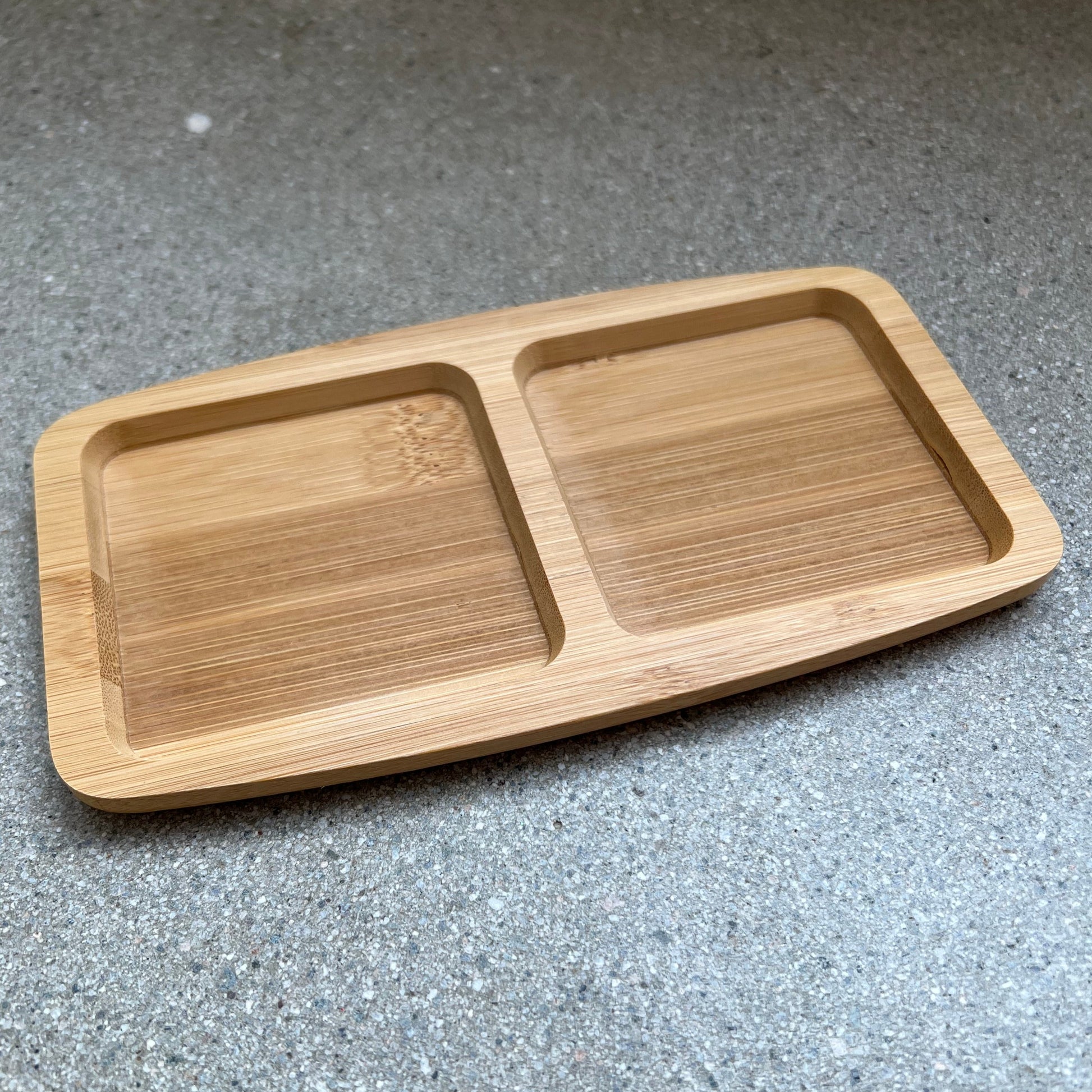 Wooden tray with two side by side, separated compartments. 