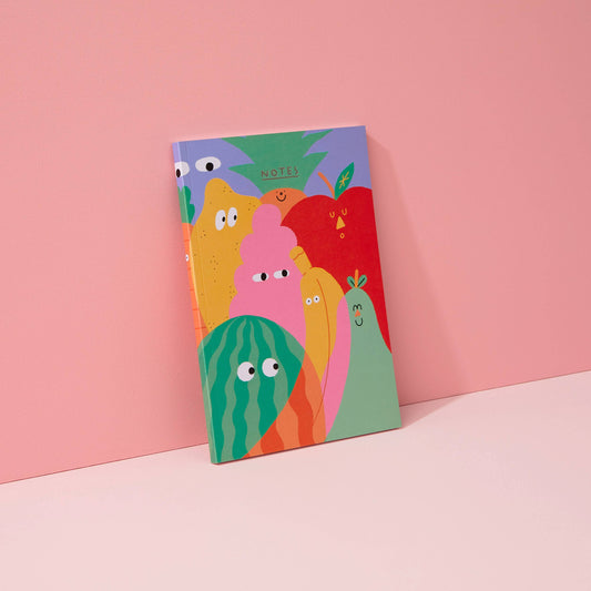 100 page blank journal notebook with various veggies with faces on it 
