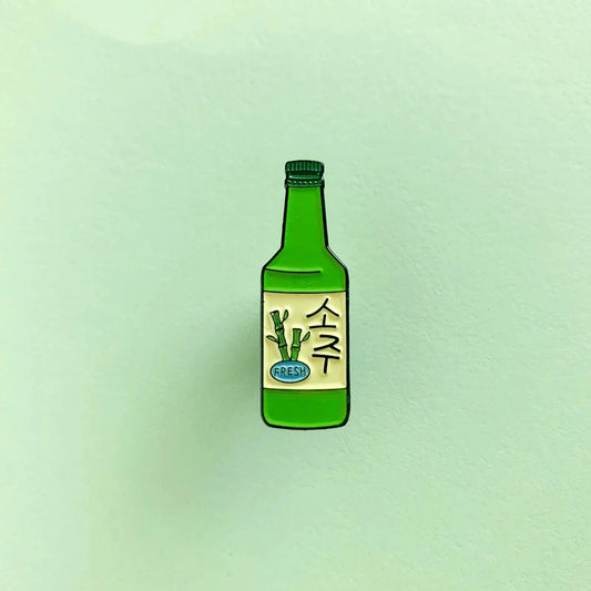 Enamel pin of a green soju bottle