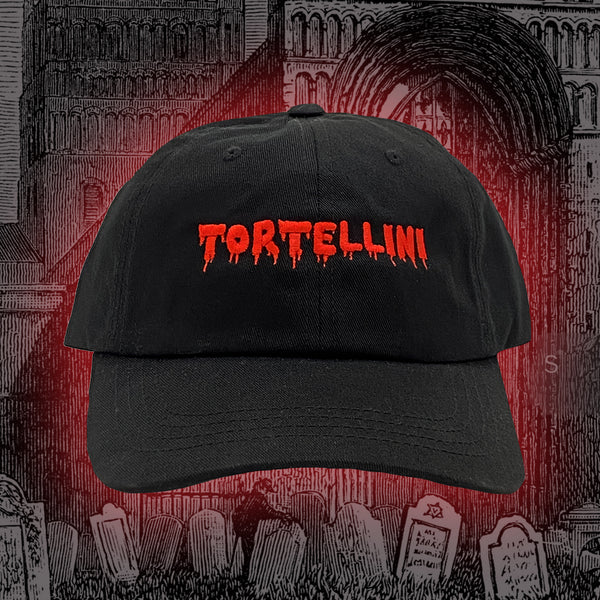 Black cap with "TORTELLINI" embroidered on the front, in red and made to look like it's dripping 