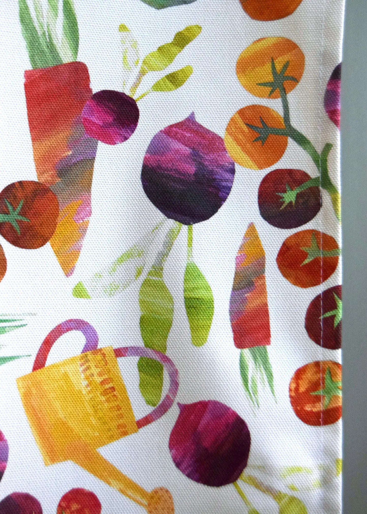 close up of the garden veggies and watering can design 